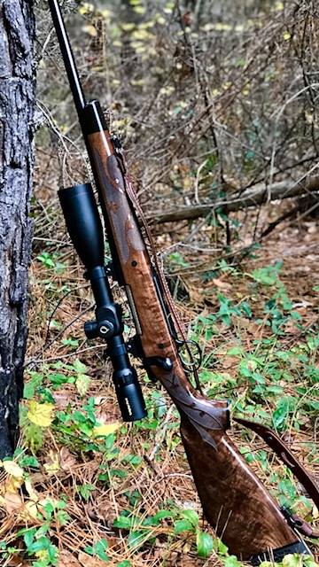 Quigley Ford Scope Long Range Scope leaning on a tree